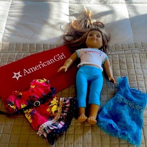 American girl doll and two dresses